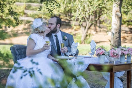 Intimate weddings moment for bride and groom who are kissing.