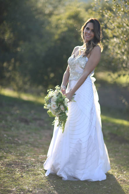 Bride standing in the oak trees at a private venue.