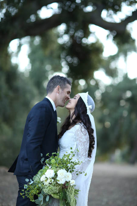 Happy Bride and Groom under the oak trees.